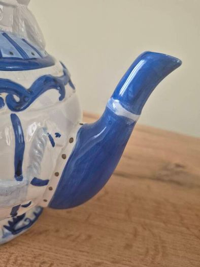 Blue and white ceramic teapot with quartz clock