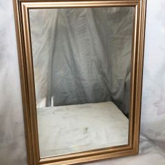 Mirror with frame in antique gold