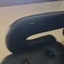 2 black faux leather bar stools with padded seats, armrests and chrome bases. Image 5
