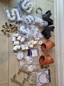 box of plumbing bits