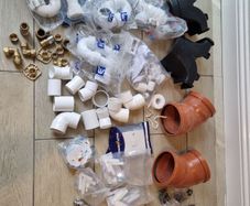 box of plumbing bits