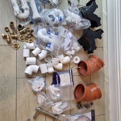 box of plumbing bits