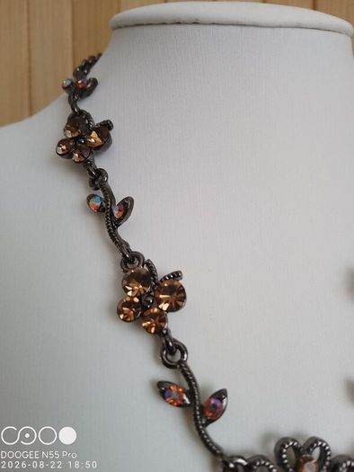 Victorian revival aesthetic  dark antiqued metal with warm amber tones