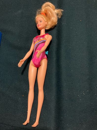 Two Barbie Dolls.