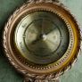 Vintage barometer with silvered dial mounted in an ornate gilt frame. Image 4
