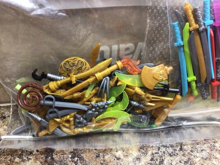 Mix bag of Lego weapons /swords