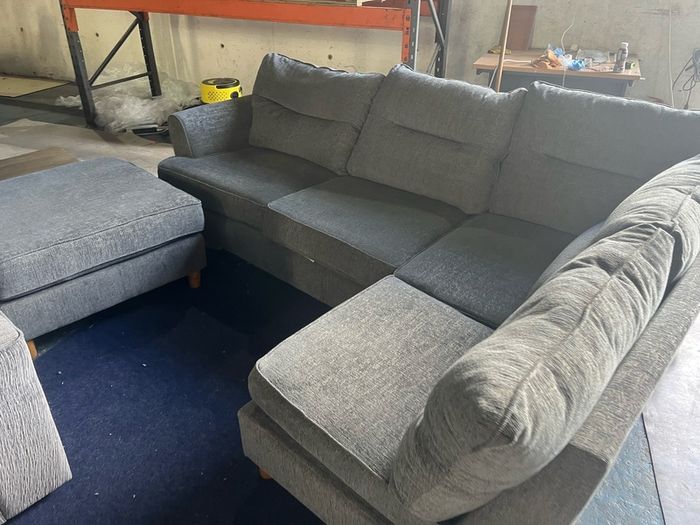 grey corner sofa with matching footstool