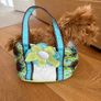 Dog stuffed animal in bag Image 3
