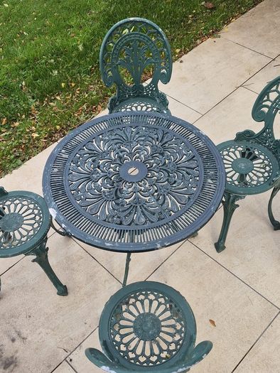 Cast metal garden table and four chairs
