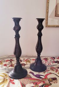 Antique pair of cast candlesticks