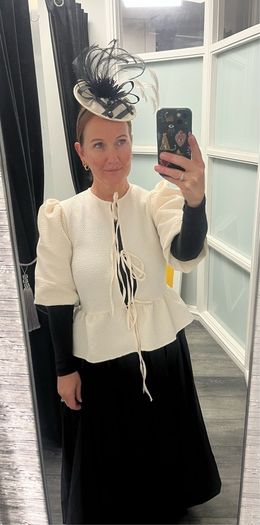 cream jacket and black skirt