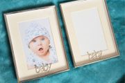 Set of 2 silver-toned metal photo frames.