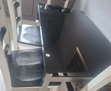 Black Glass Table And 4 Black And White Wooden Chairs
