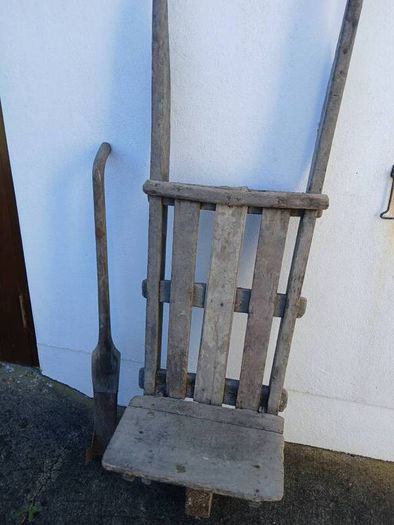Antique peat wheelbarrow and peat spade