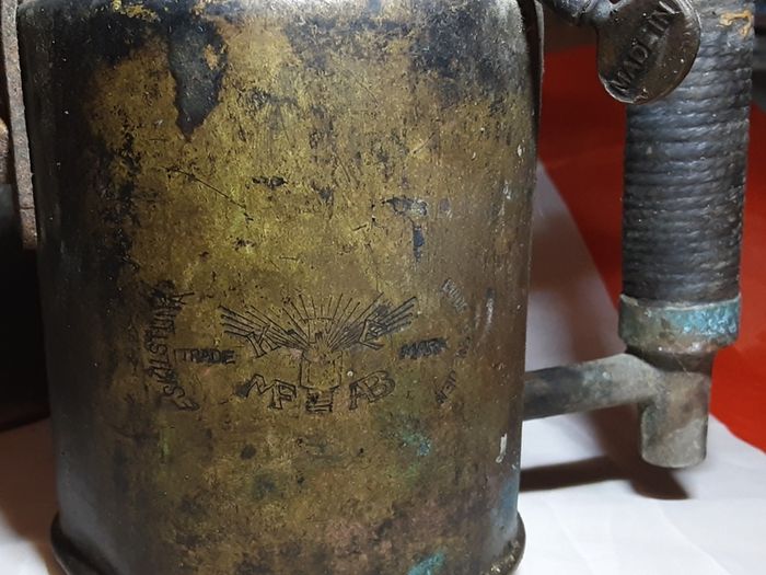three vintage brass torches,