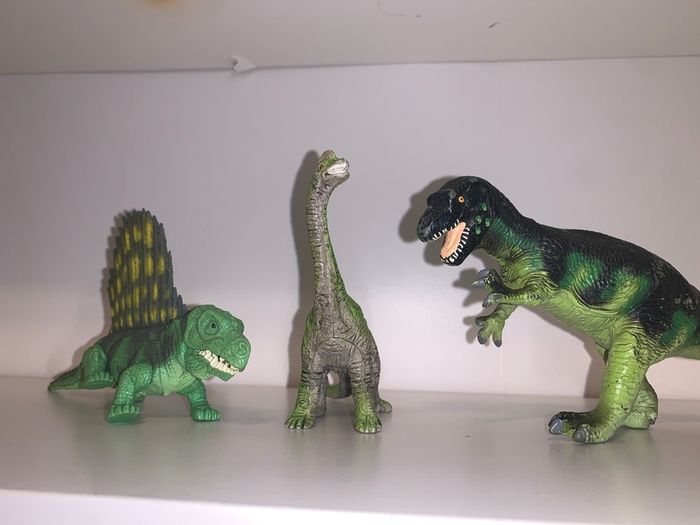 Three dinosaur toys