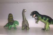 Three dinosaur toys