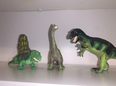 Three dinosaur toys