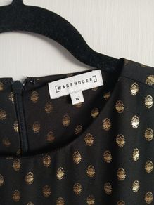 warehouse 1960s drop waist black shift dress with metallic polka dot