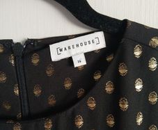 warehouse 1960s drop waist black shift dress with metallic polka dot