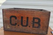 Old beer bottle crate stamped "C U B" and "8 66"