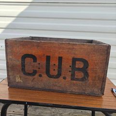 Old beer bottle crate stamped "C U B" and "8 66"