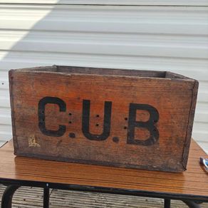 Old beer bottle crate stamped "C U B" and "8 66"