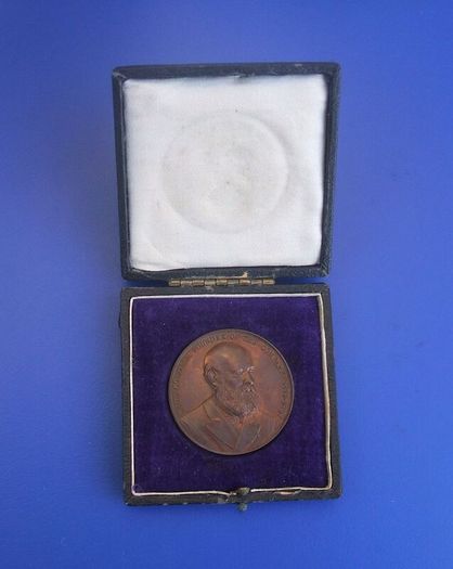 DALZELL STEEL (David Colville & Sons Ltd) - an antique 21 years long-service award medal in original presentation case (scarce)