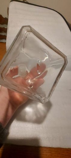 Art deco glass whiskey decanter with lid,,buyer collects or pays postage thank you, good patina condition,,sold as is, see pictures for condition,,