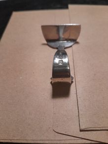 old silver baby food pusher