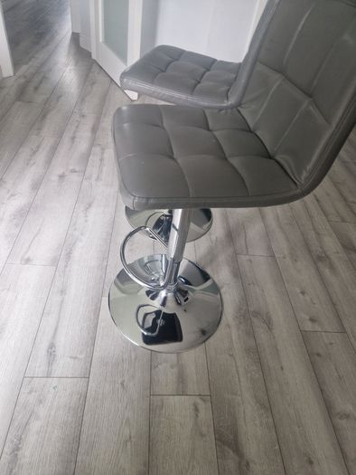 2 grey leather look swivel bar stools