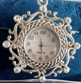 Ladies Quartz Necklace Watch with Filigree Design on Casing and Surrounded by 8 White-Silver Diamante Stones.