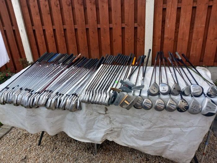 A selection of Golf clubs. Bags and golf balls.