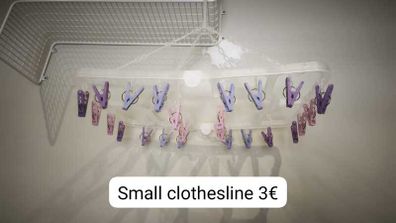 Hanging clothes dryer with pegs