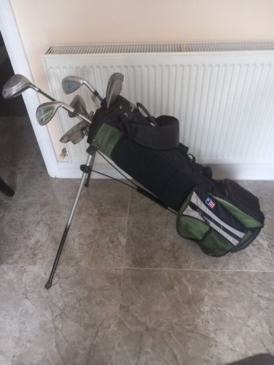 A selection of junior golf clubs and bag.
