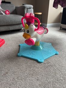 Spinning ride on unicorn