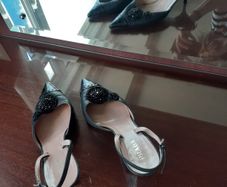 Black Prada sling back stilettos