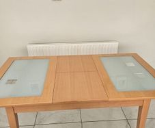 Extendable Light Wood Dining Table with Glass Pane