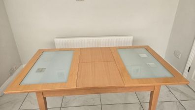 Extendable Light Wood Dining Table with Glass Pane