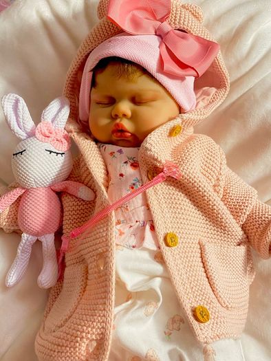 doll.       Reborn baby doll very cute COMES WITH A XMAS OUTFIT