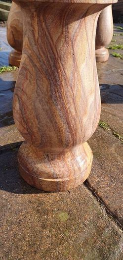 Sandstone garden table and two benches.