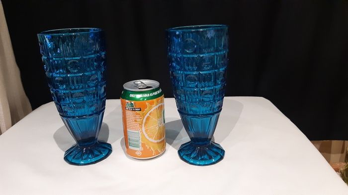 A pair of blue/deep turquoise glass vases