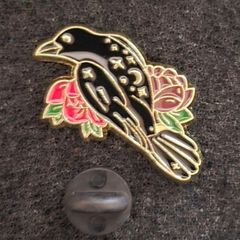 Raven and rose, pin back badge.