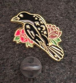 Raven and rose, pin back badge.