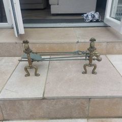 Brass fire dogs and fire set