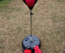 Freestanding boxing bag and boxing gloves