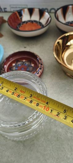 7 trinkelt itmes Large Mint Green Fern Bowl and small bowl DANU Designer Ceramics 20.00 E.Crystal glass lided trinklet dish 15.00 E.Gold dish 10.00E.  Southe afirca bowl smale on 8.00 E. other        larger one 10.00E.  Marccoin one 8.00E.  wood trinklet 