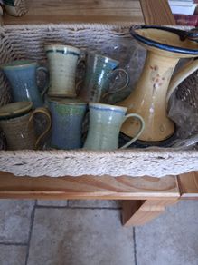 6 ceramic mugs and candleholder