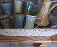 6 ceramic mugs and candleholder