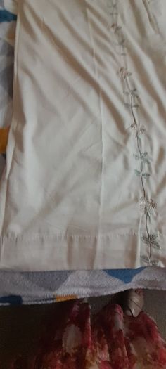 A pair of vintage embroidered curtains